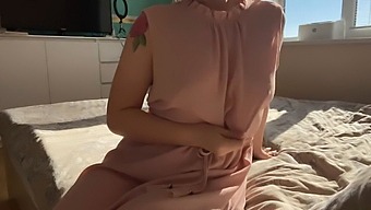 A Woman In A Soft Pink Dress Explores Her Intimate Areas
